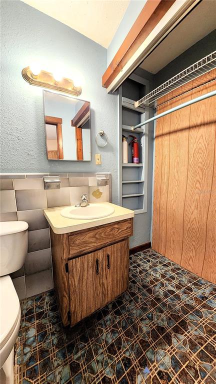 6321 Runnel Drive New Port Richey, FL 34653 - Photo 11 of 18 a bathroom with a sink and a toilet