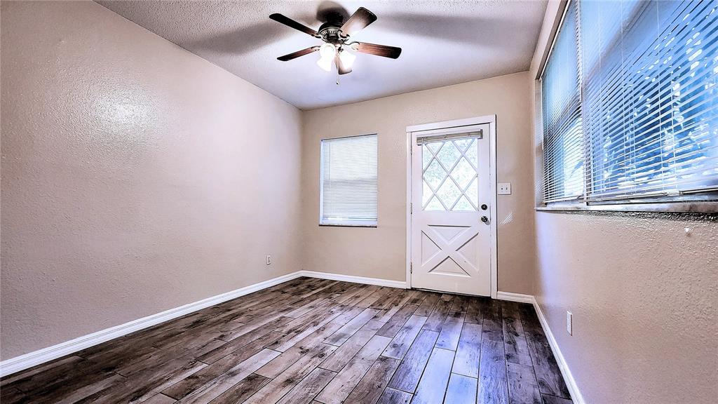 6321 Runnel Drive New Port Richey, FL 34653 - Photo 4 of 18 a view of an empty room with wooden floor and a window