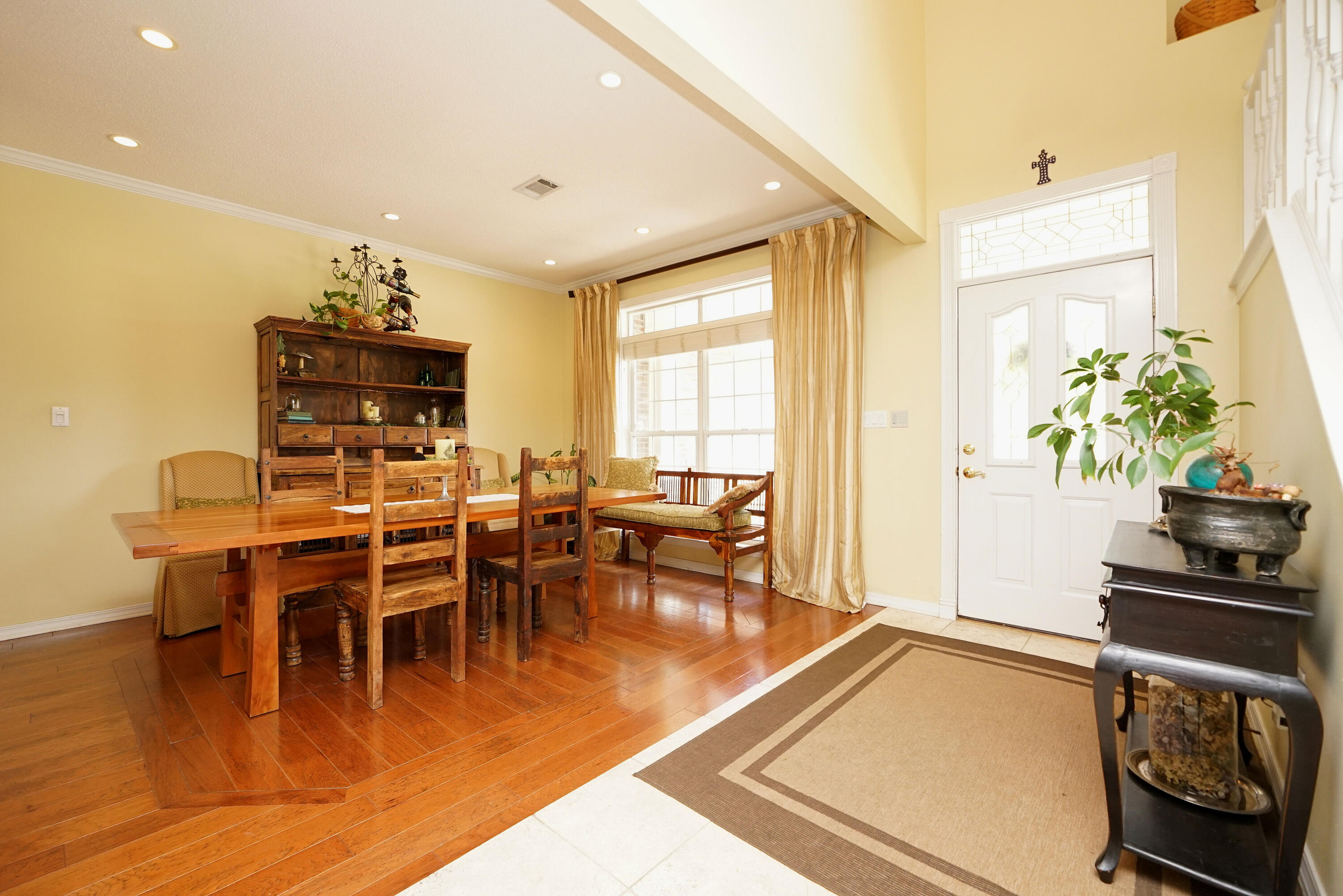 941 Ruckel Drive Niceville, FL 32578 - Photo 11 of 57 a dining room with furniture potted plants and wooden floor