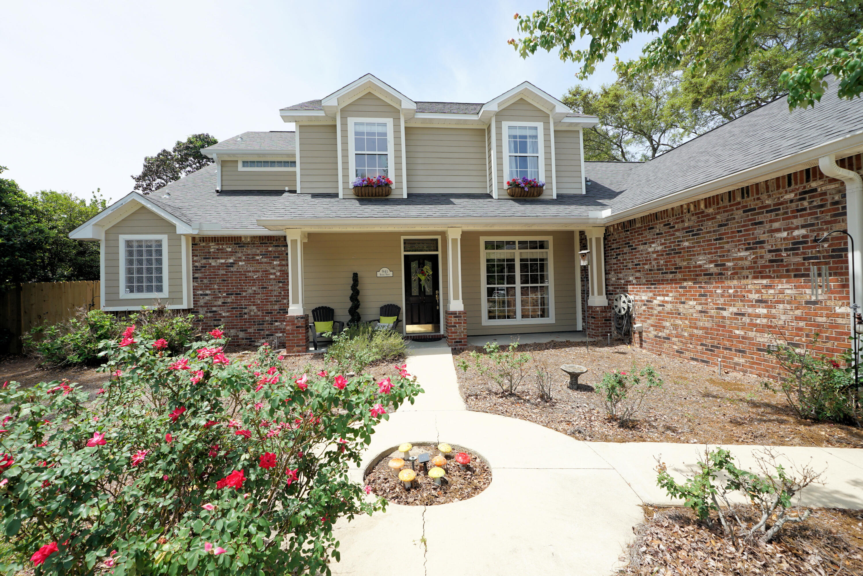 941 Ruckel Drive Niceville, FL 32578 - Photo 2 of 57 a front view of a house with a yard and garage