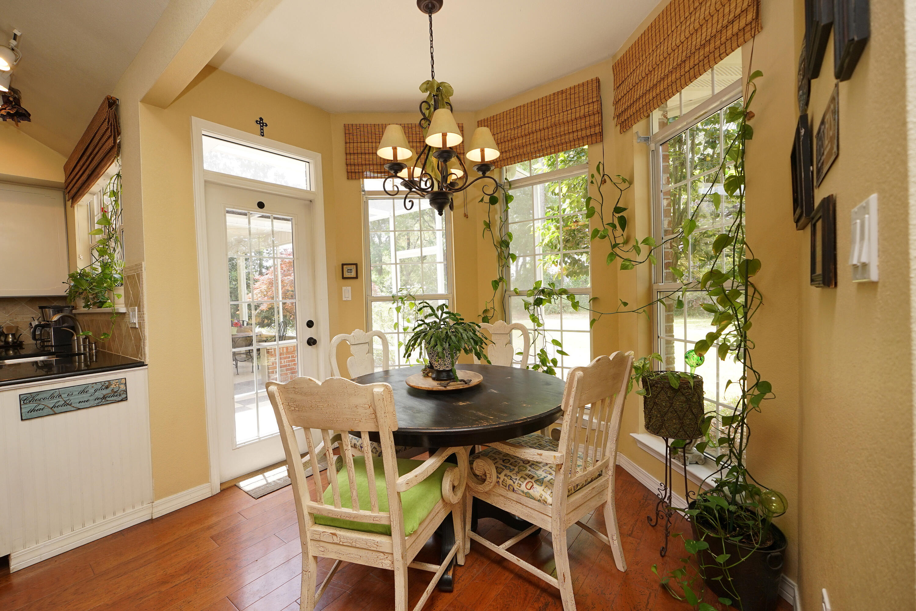 941 Ruckel Drive Niceville, FL 32578 - Photo 24 of 57 a view of a dining room with furniture and chandelier