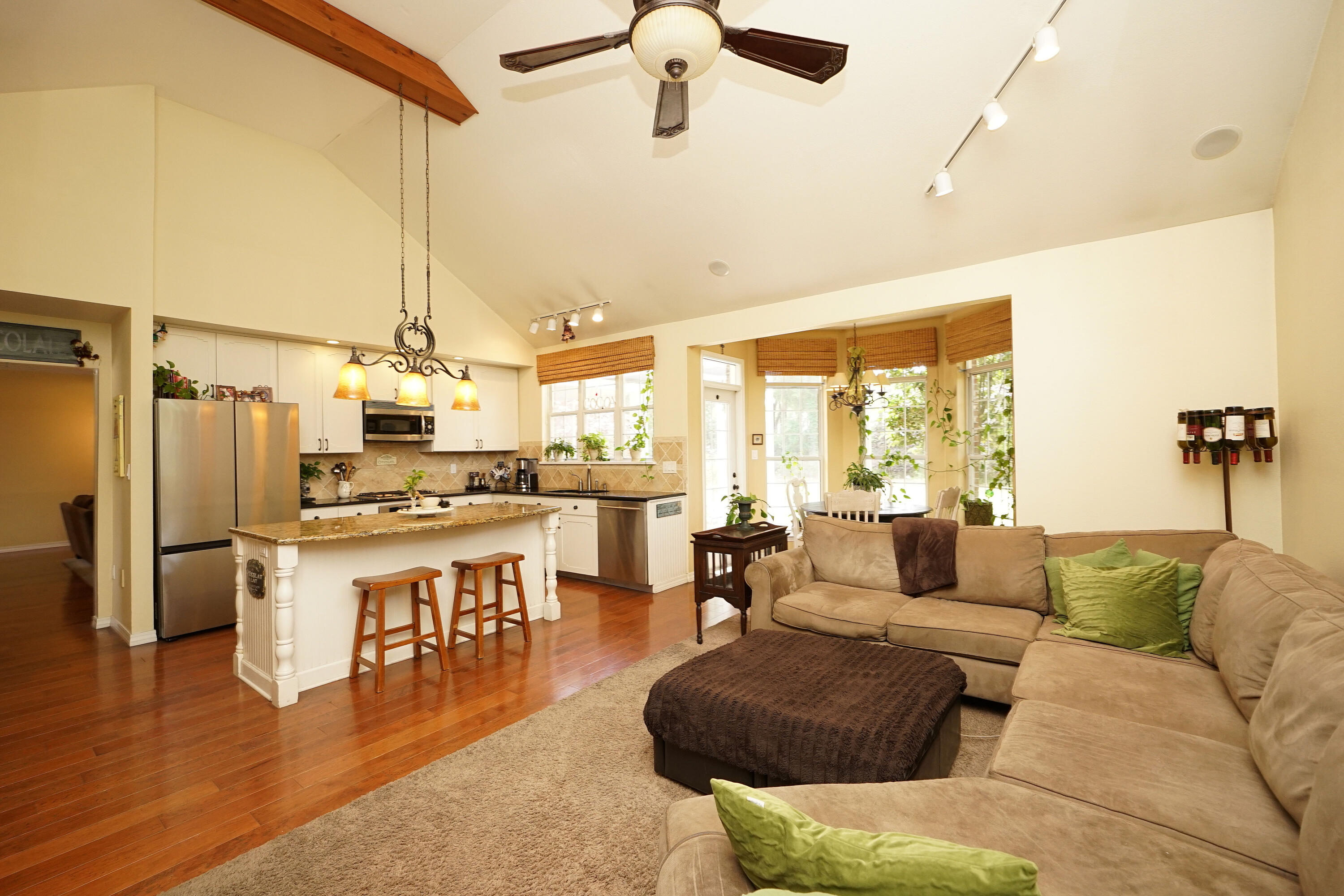 941 Ruckel Drive Niceville, FL 32578 - Photo 26 of 57 a living room with stainless steel appliances kitchen island granite countertop furniture and a wooden floor