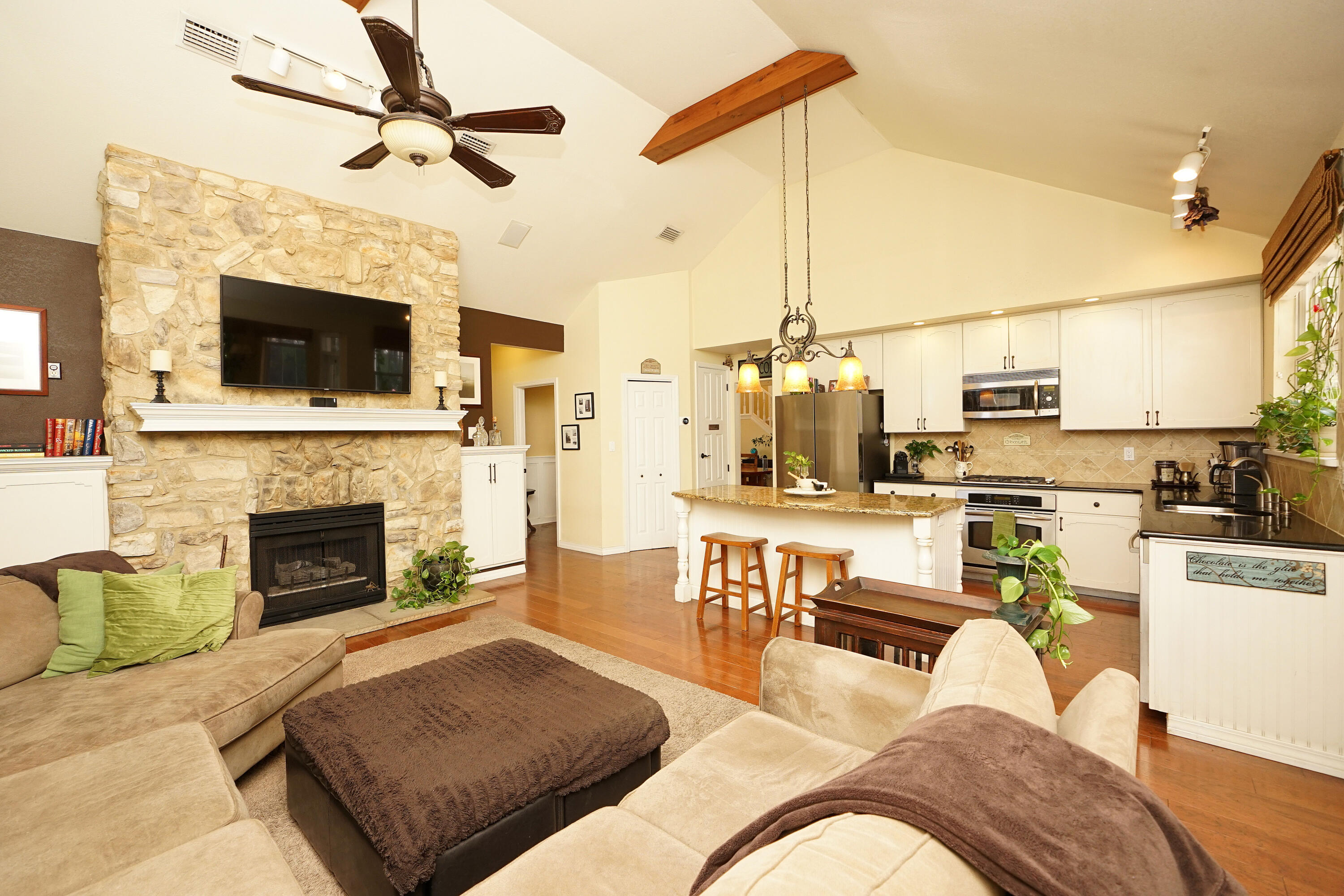 941 Ruckel Drive Niceville, FL 32578 - Photo 27 of 57 a living room with furniture a flat screen tv and a fireplace
