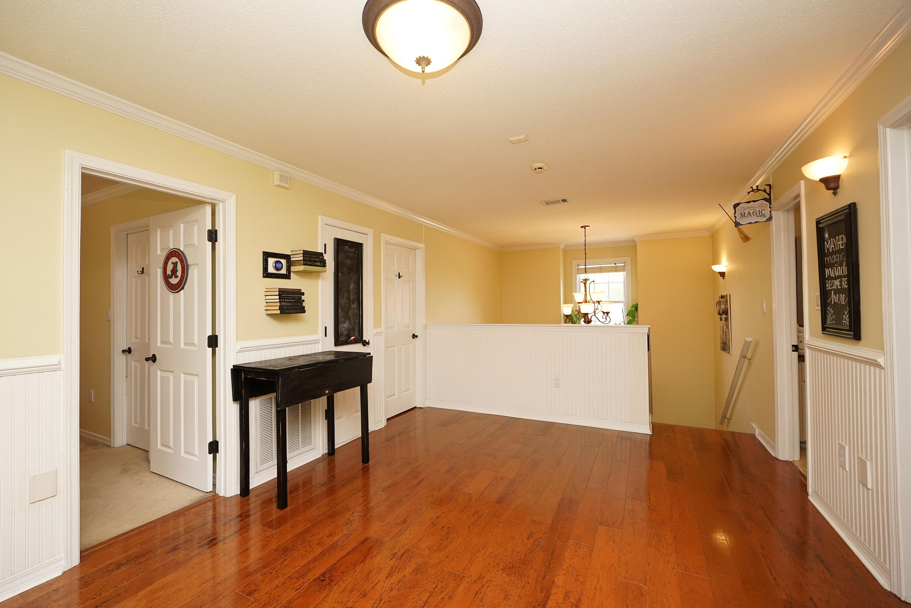 941 Ruckel Drive Niceville, FL 32578 - Photo 39 of 57 a view of a hallway with wooden floor and staircase