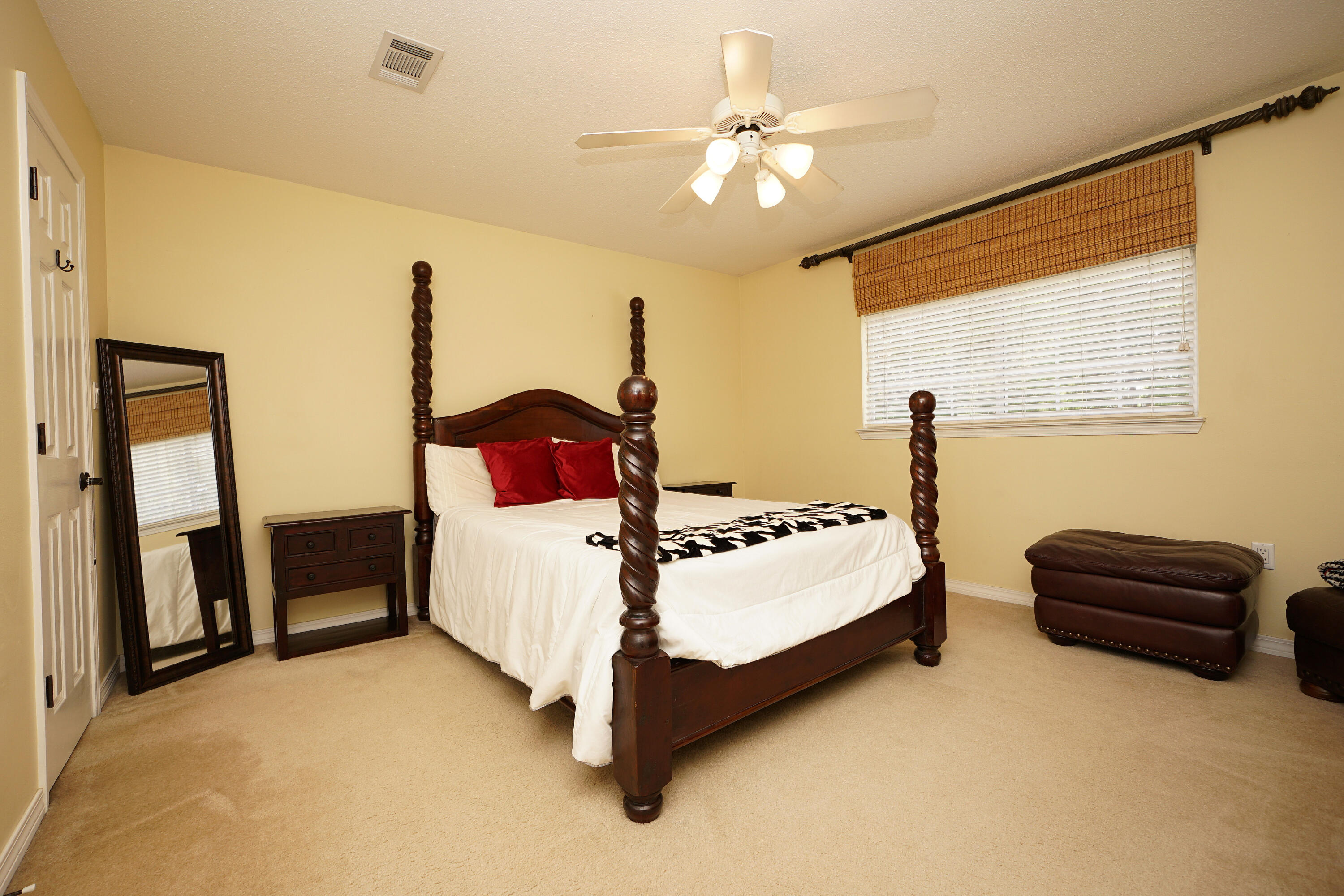 941 Ruckel Drive Niceville, FL 32578 - Photo 41 of 57 a bedroom with a bed and a chandelier