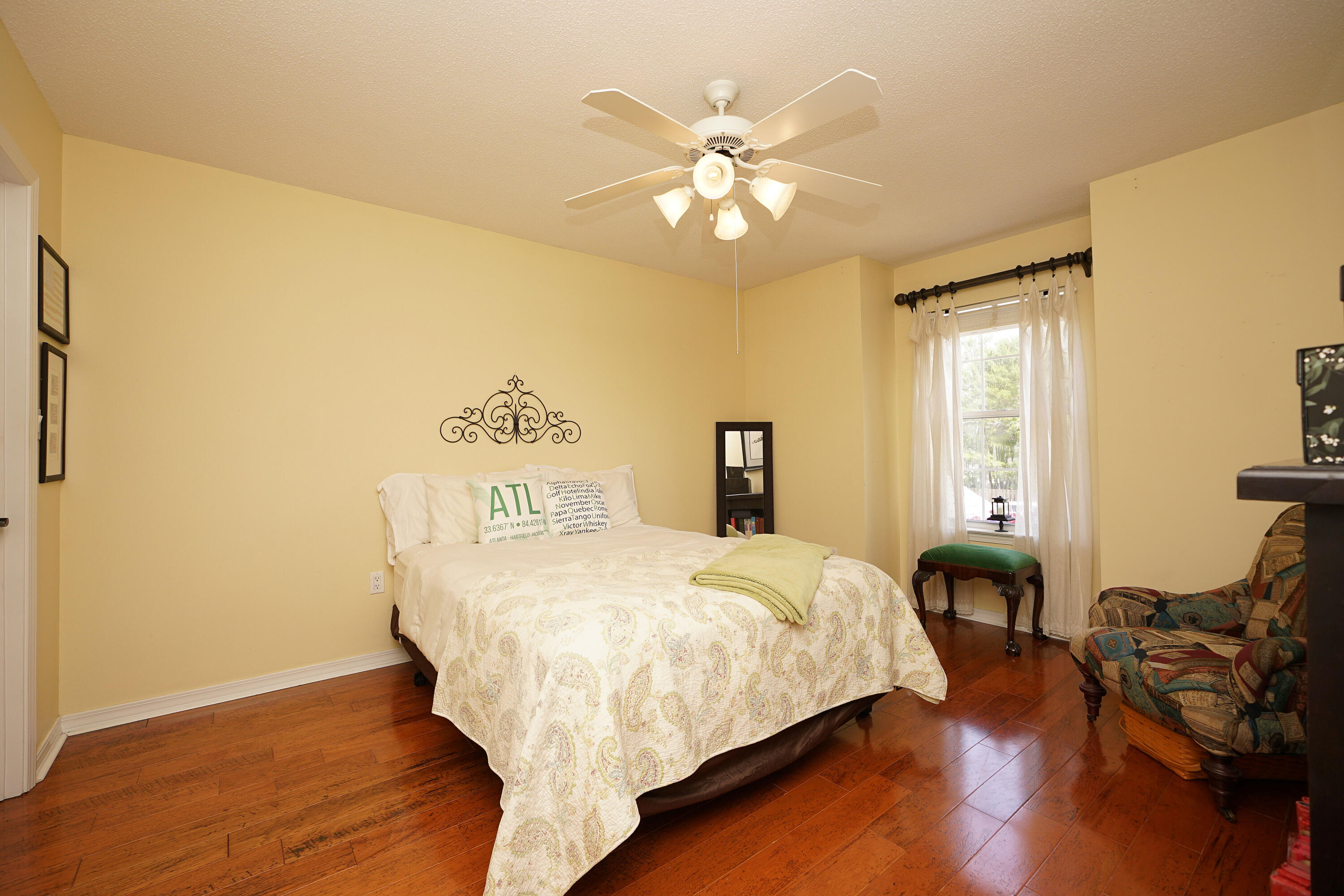 941 Ruckel Drive Niceville, FL 32578 - Photo 42 of 57 a bedroom with a bed and wooden floor