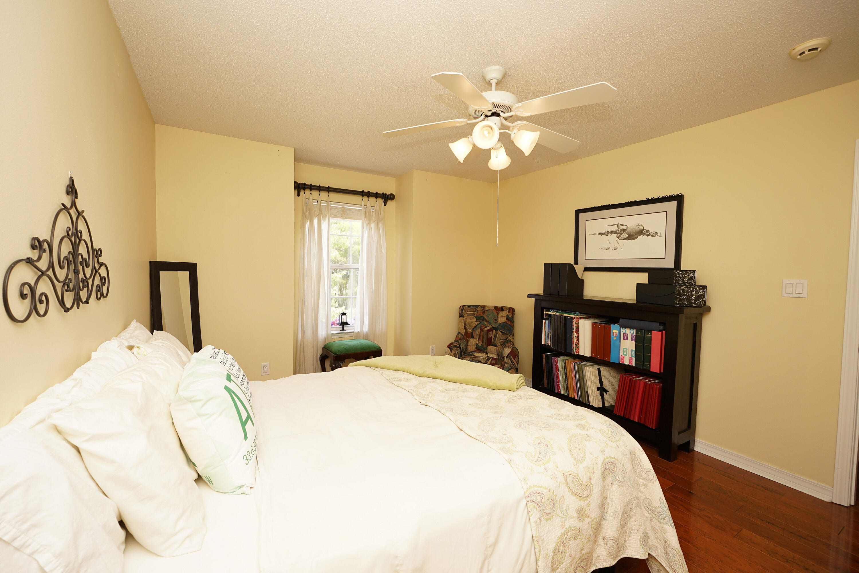 941 Ruckel Drive Niceville, FL 32578 - Photo 43 of 57 a bedroom with a bed and a book shelf
