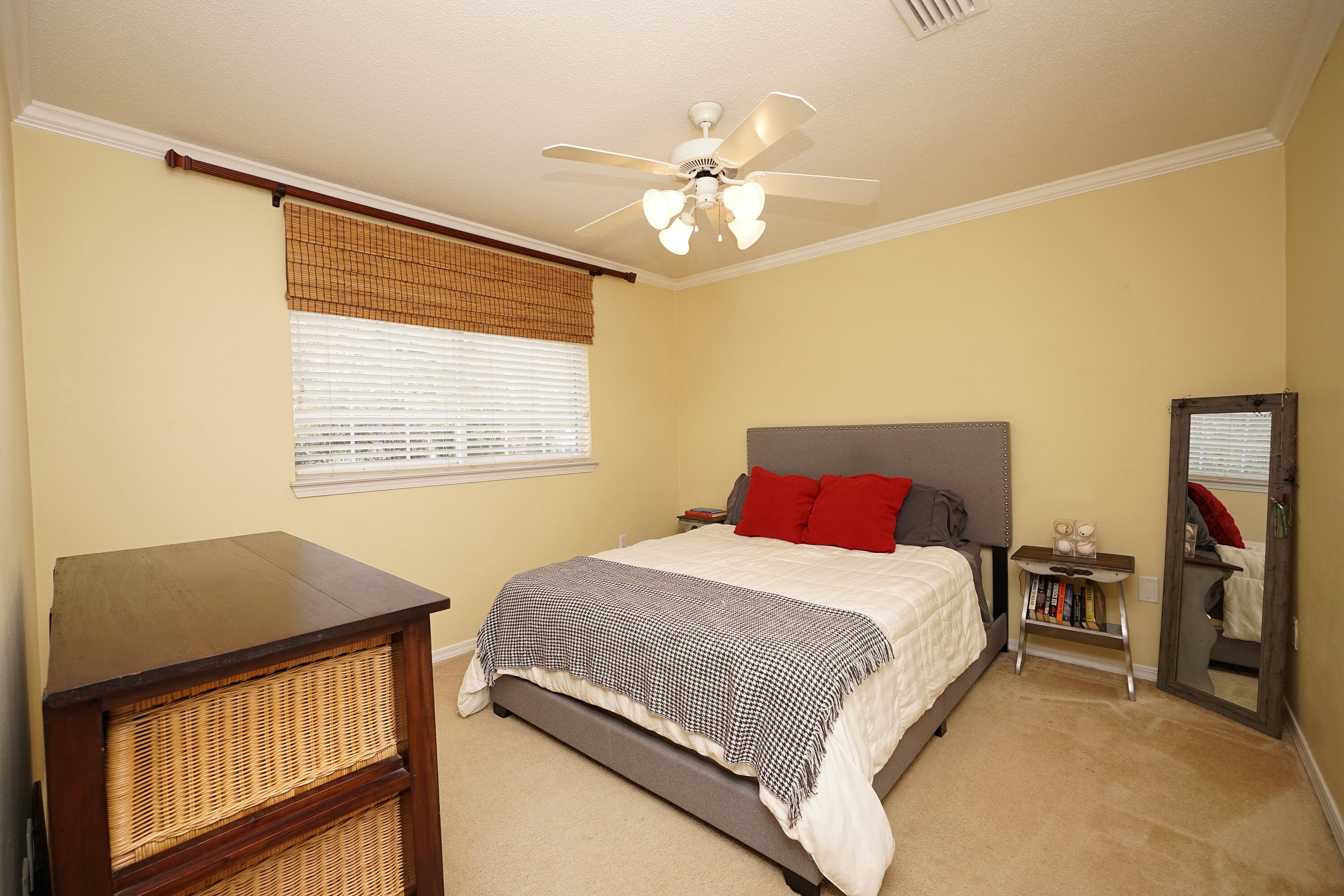 941 Ruckel Drive Niceville, FL 32578 - Photo 44 of 57 a bedroom with a bed and a chandelier