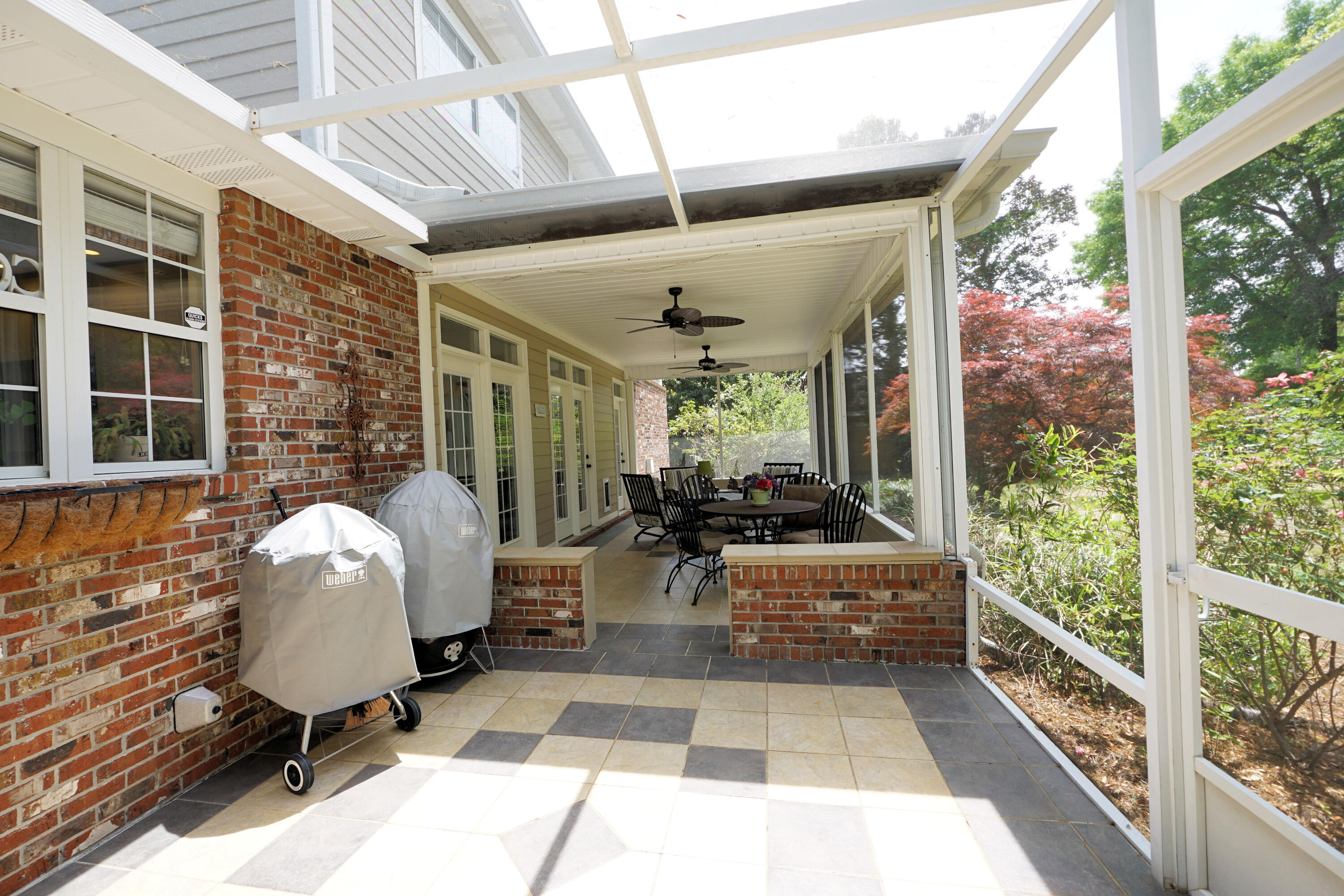 941 Ruckel Drive Niceville, FL 32578 - Photo 49 of 57 a view of a patio with table and chairs and potted plants