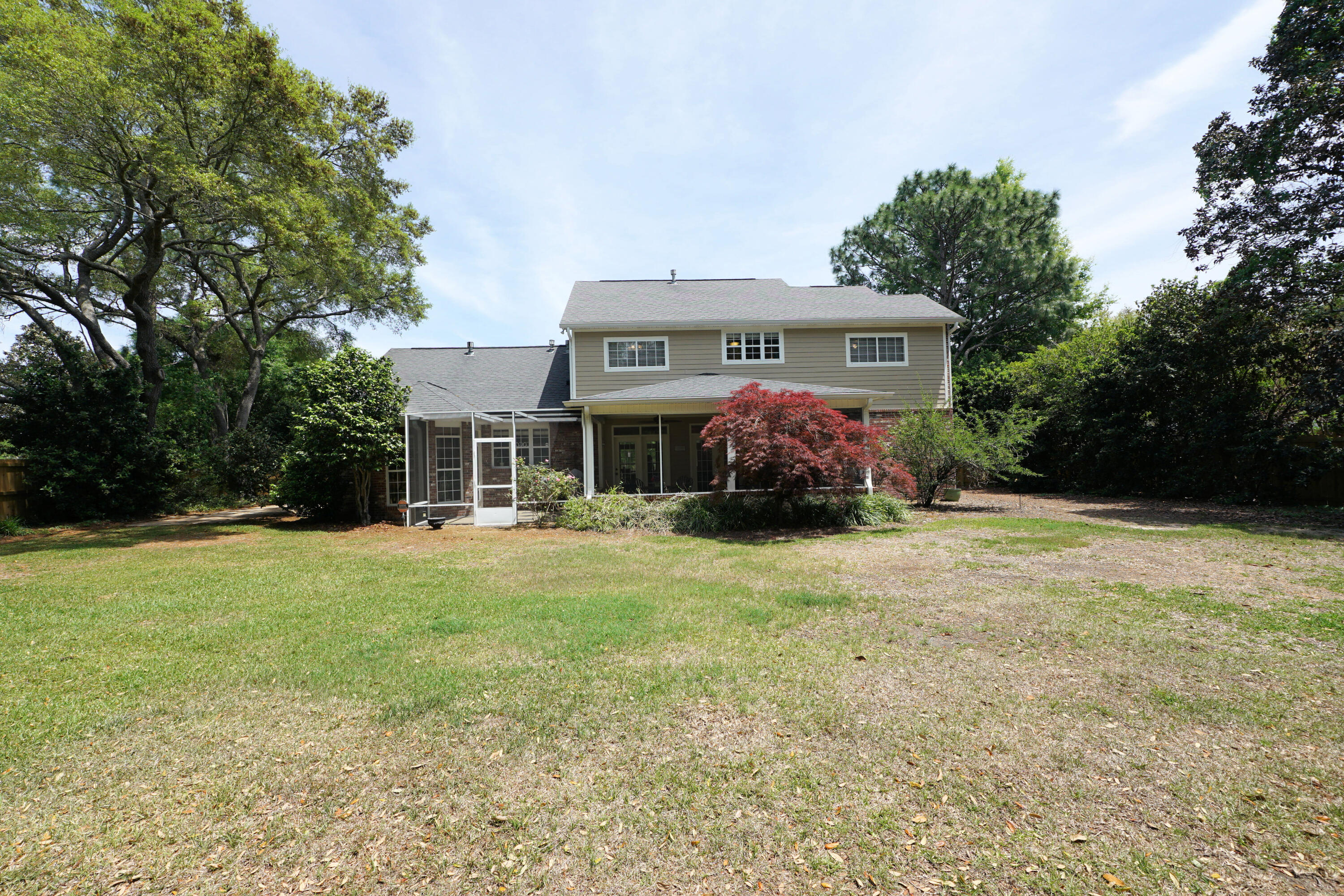 941 Ruckel Drive Niceville, FL 32578 - Photo 52 of 57 a front view of a house with a garden