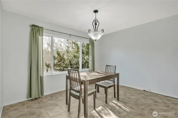 a view of a dining room with furniture window and outside view