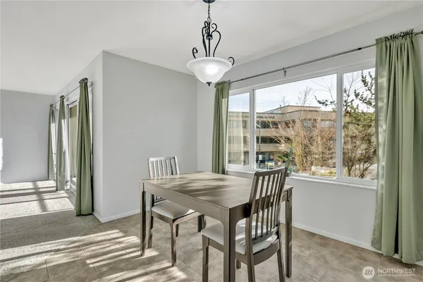 a view of a dining room with furniture window and outside view