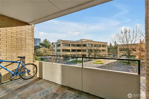 a view of a balcony with chairs