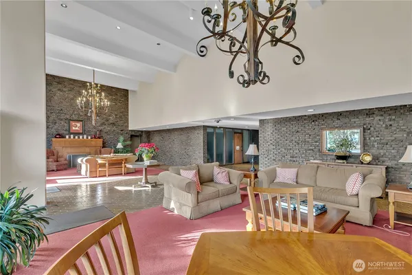 a living room with furniture or couch and a dining table