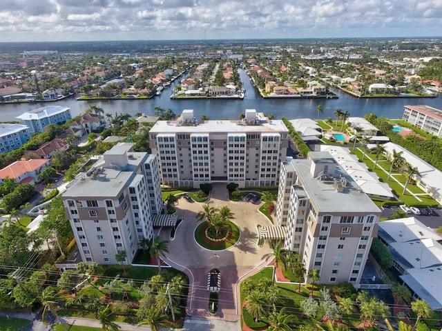 an aerial view of lake and residential houses with outdoor space