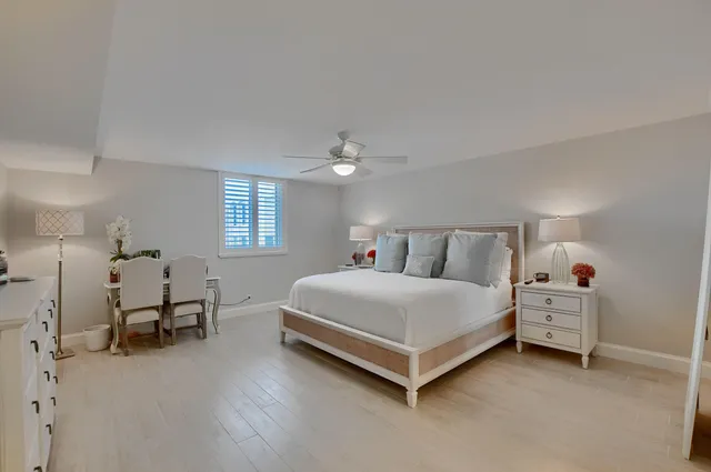 a spacious bedroom with a bed and window