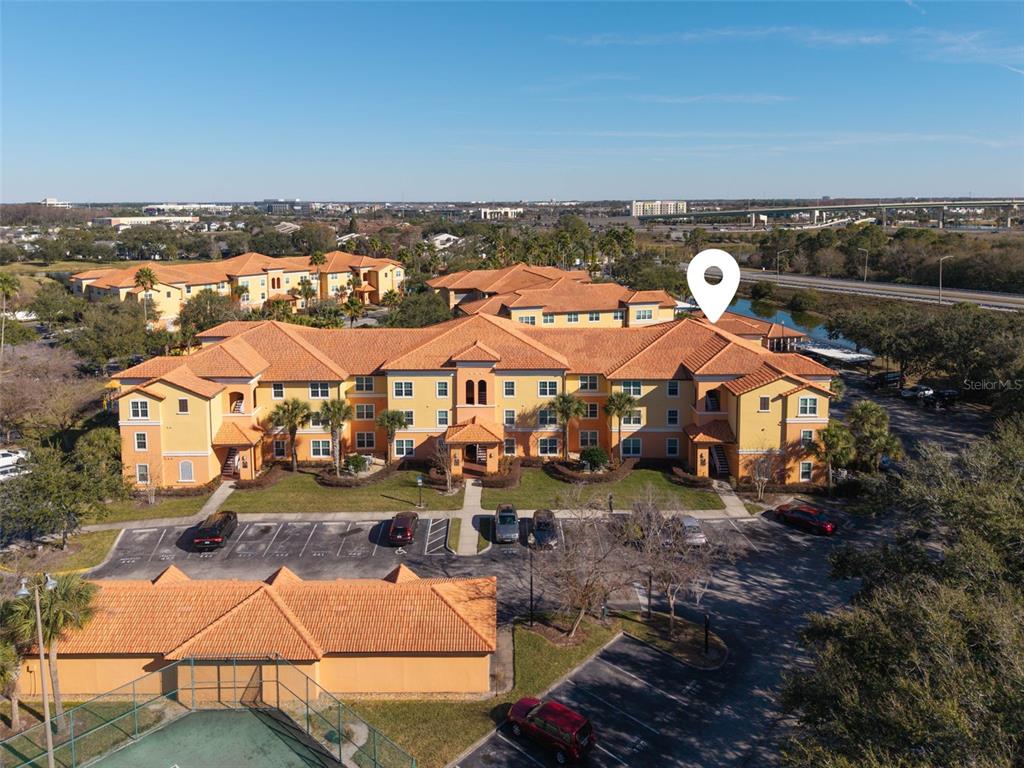an aerial view of a house with a ocean view