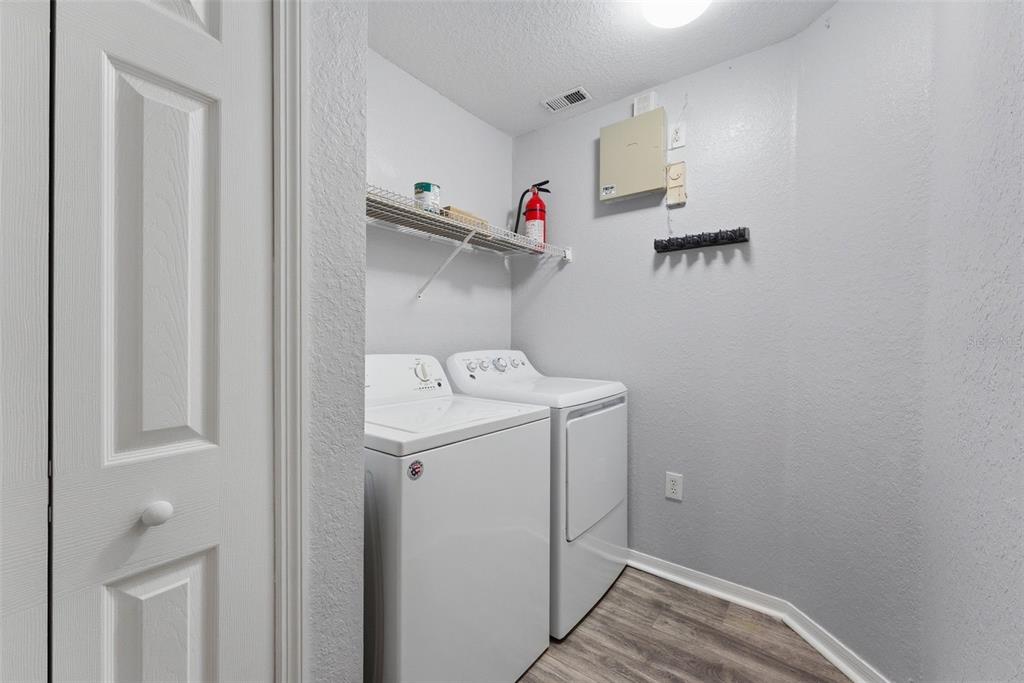 5479 Vineland Road, Unit 9202 Orlando, FL 32811 - Photo 11 of 31 a utility room with dryer and washer