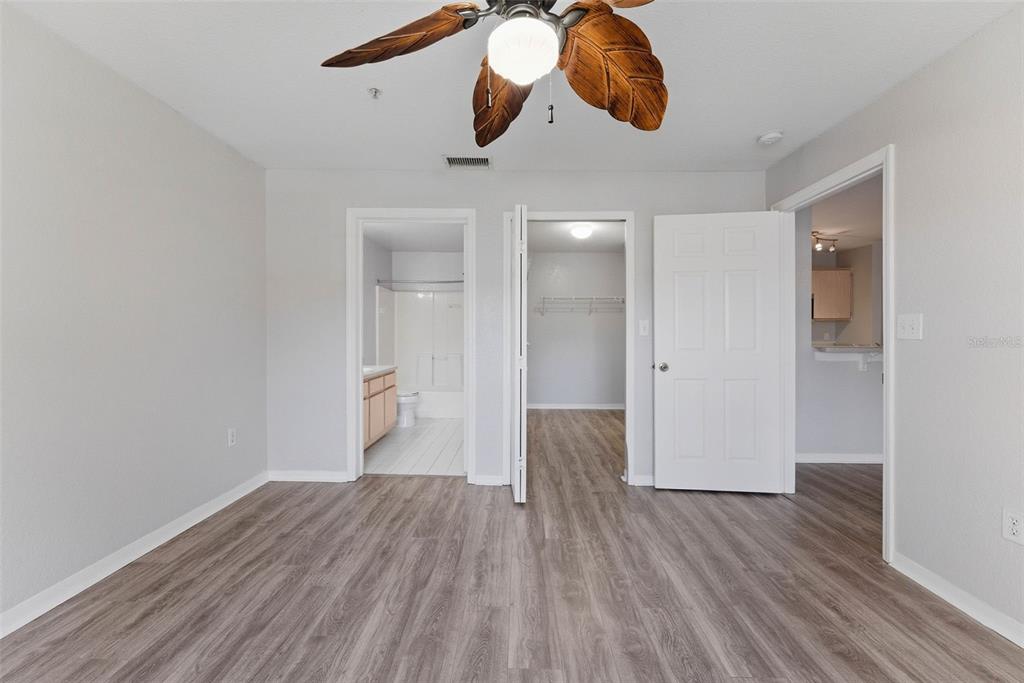 5479 Vineland Road, Unit 9202 Orlando, FL 32811 - Photo 22 of 31 a view of an empty room and wooden floor