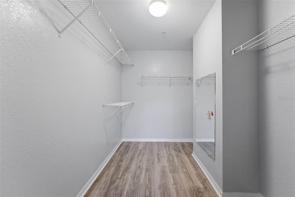 5479 Vineland Road, Unit 9202 Orlando, FL 32811 - Photo 23 of 31 a view of a room with racks on the wall