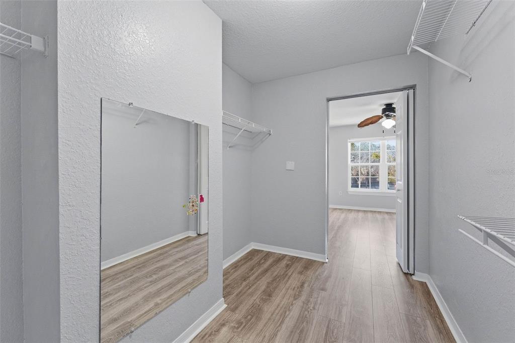 5479 Vineland Road, Unit 9202 Orlando, FL 32811 - Photo 24 of 31 a view of wooden floor in a room
