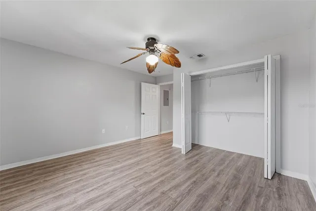 a view of room with wooden floor