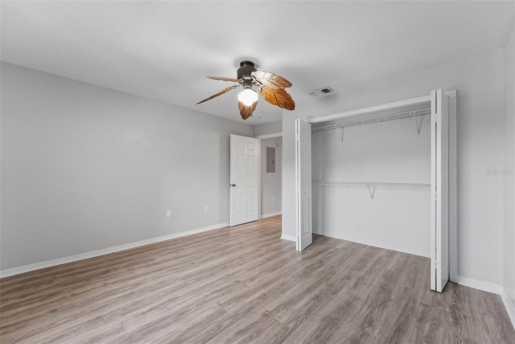 5479 Vineland Road, Unit 9202 Orlando, FL 32811 - Photo 30 of 31 a view of room with wooden floor