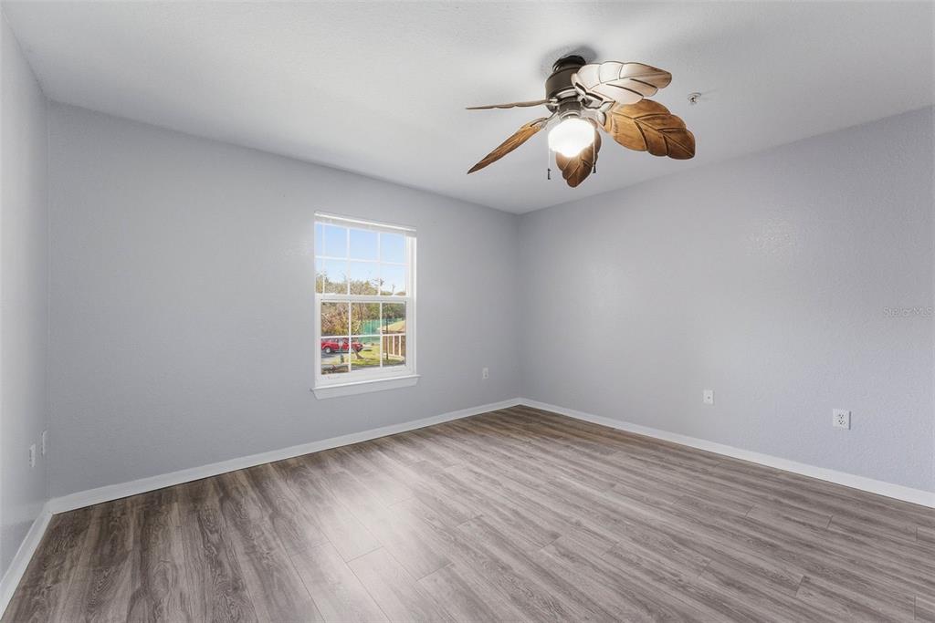 5479 Vineland Road, Unit 9202 Orlando, FL 32811 - Photo 31 of 31 a view of room with window and wooden floor