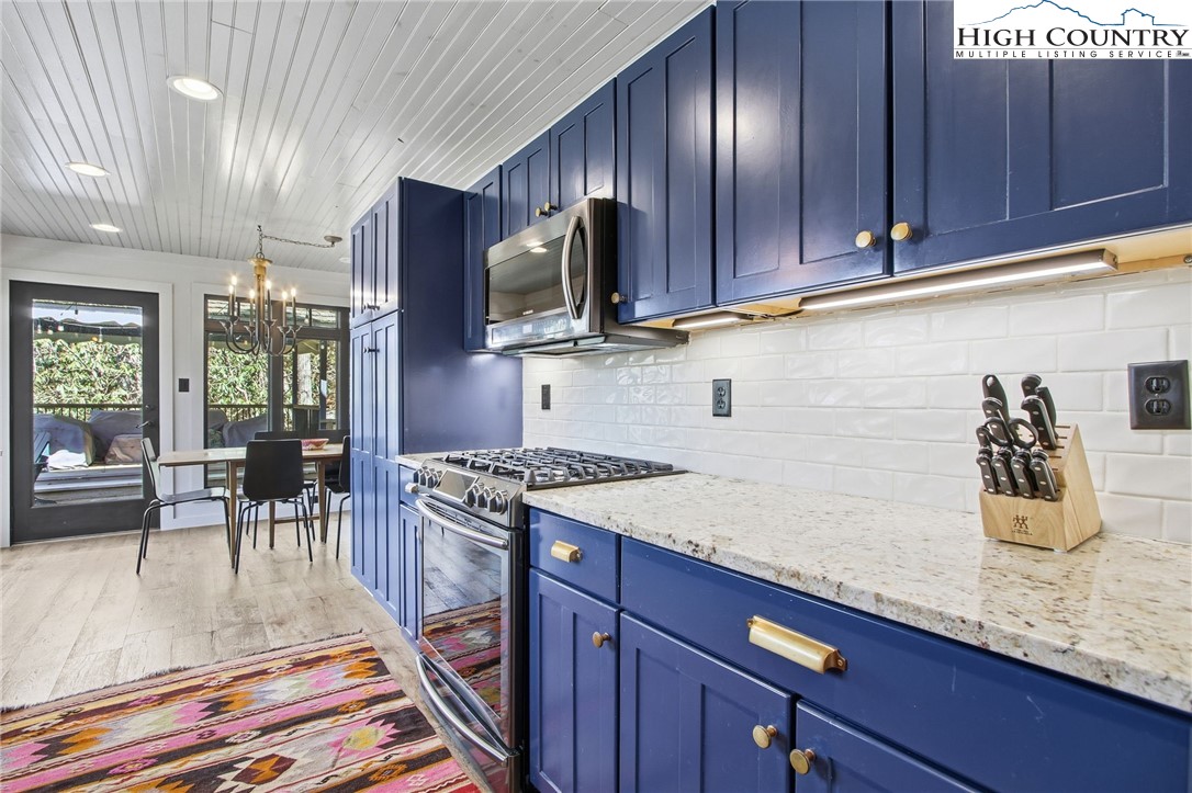 313 Birch Boone, NC 28607 - Photo 13 of 50 a kitchen with granite countertop stainless steel appliances and wooden cabinets