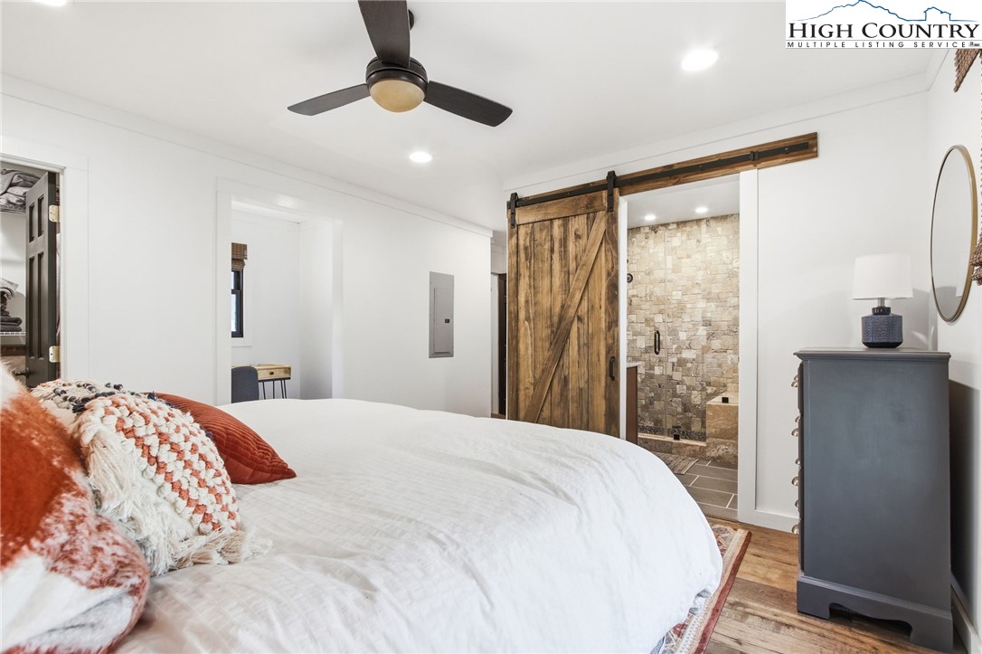 313 Birch Boone, NC 28607 - Photo 19 of 50 a bedroom with a large bed and a large window