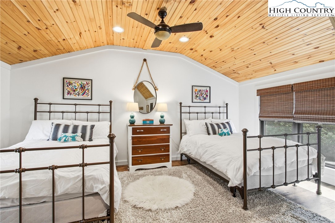 313 Birch Boone, NC 28607 - Photo 27 of 50 a bedroom with a bed and a table