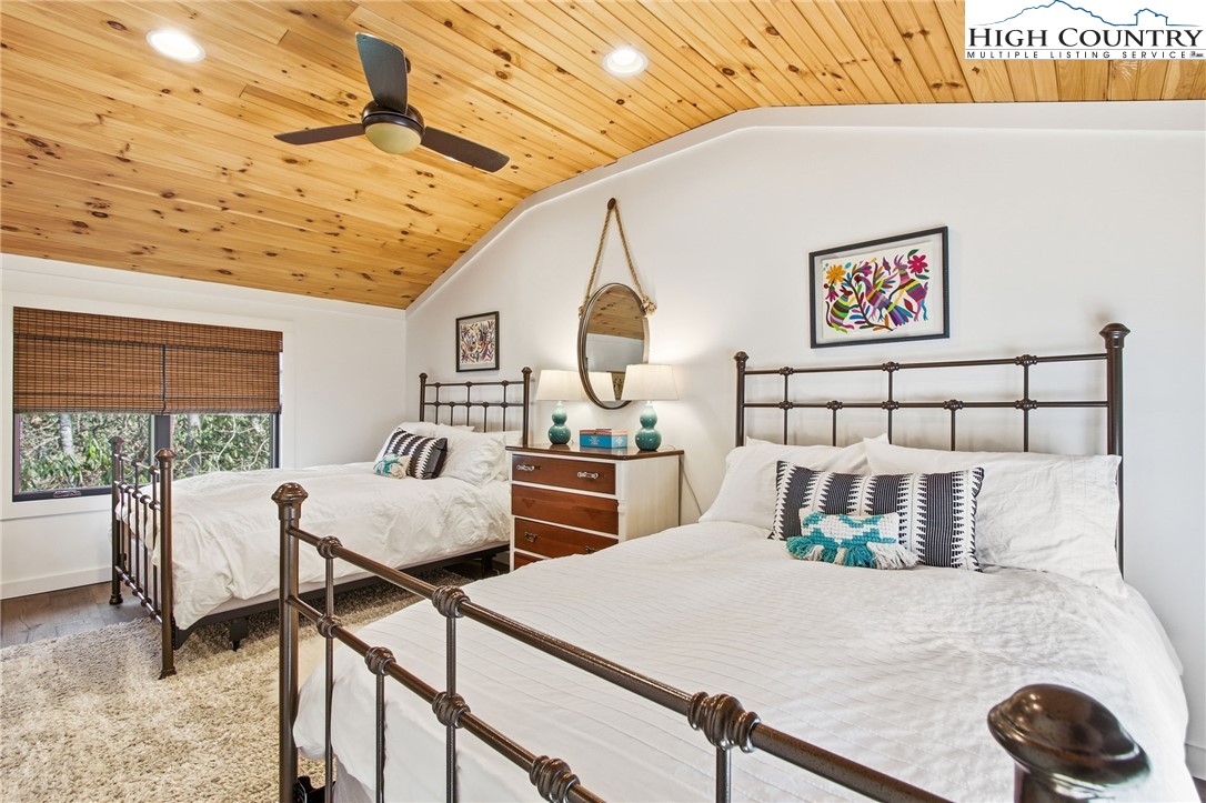 313 Birch Boone, NC 28607 - Photo 29 of 50 a bedroom with furniture and a large window