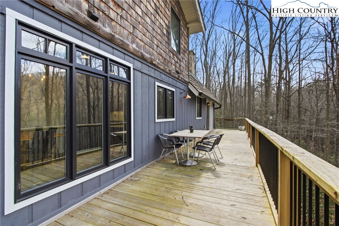 313 Birch Boone, NC 28607 - Photo 42 of 50 a balcony with wooden floor and outdoor seating