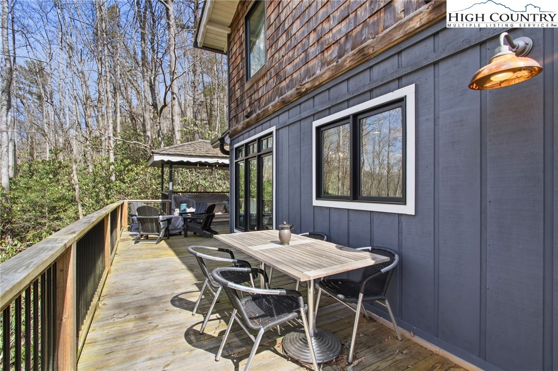 313 Birch Boone, NC 28607 - Photo 44 of 50 a view of a patio with table and chairs and potted plants