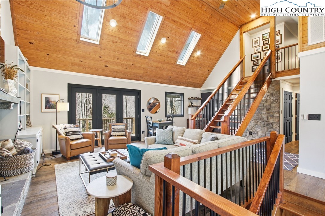 313 Birch Boone, NC 28607 - Photo 8 of 50 a living room with furniture a fireplace and a large window