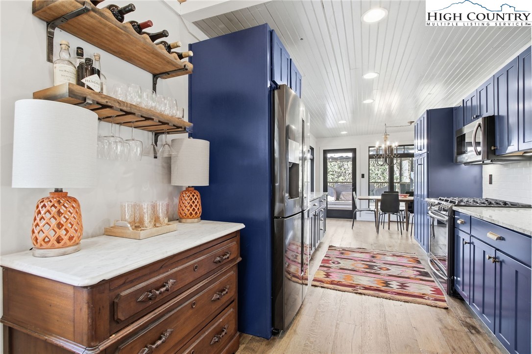 313 Birch Boone, NC 28607 - Photo 10 of 50 a living room with stainless steel appliances furniture a rug and a kitchen view
