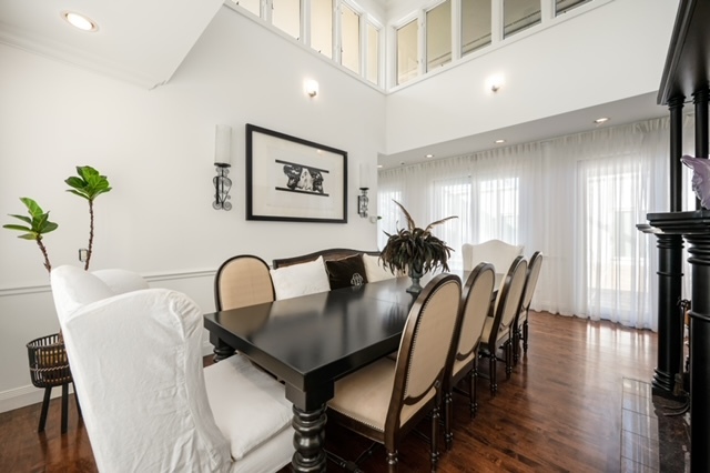 115 Dickens Road Northfield, IL 60093 - Photo 5 of 24 a view of a a dining room with furniture window and wooden floor