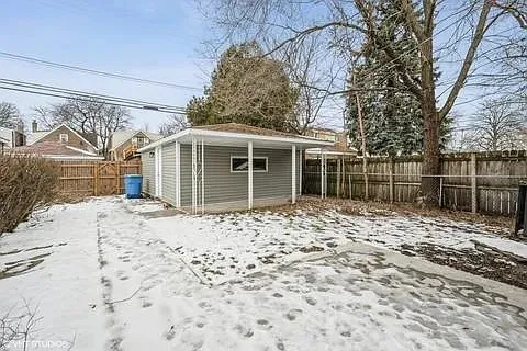 a view of a backyard with a large tree