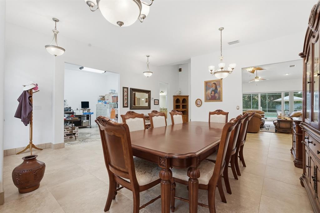 105 Beach Street Ponce Inlet, FL 32127 - Photo 14 of 67 a dining room with furniture and wooden floor