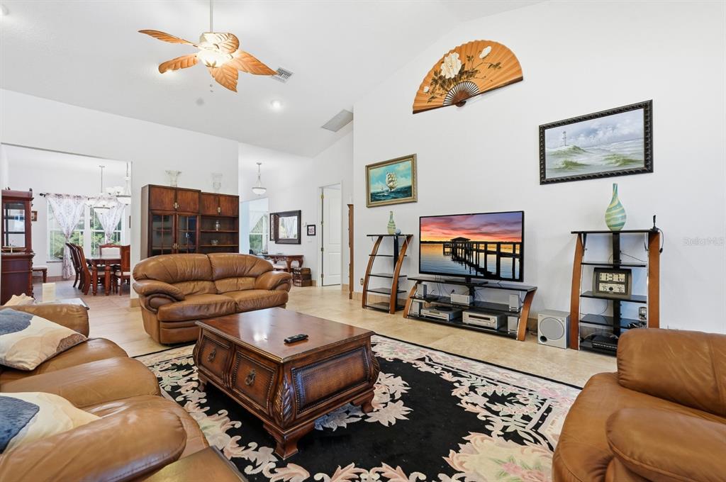 105 Beach Street Ponce Inlet, FL 32127 - Photo 20 of 67 a living room with furniture and a flat screen tv