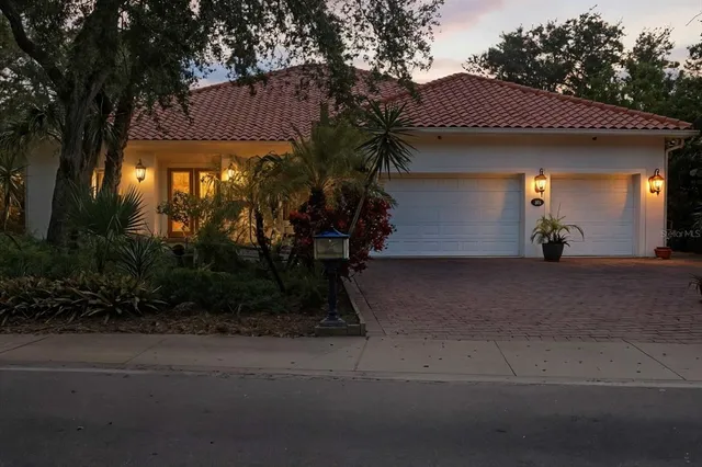 a view of a backyard with table and chairs with wooden floor and fence