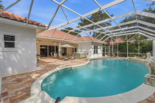 a picture of a bathroom with a sink a mirror and shower