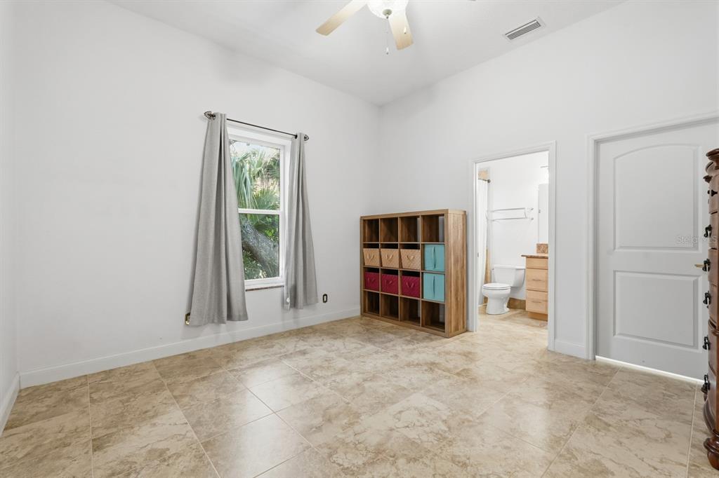 105 Beach Street Ponce Inlet, FL 32127 - Photo 44 of 67 an empty room with closet and a window