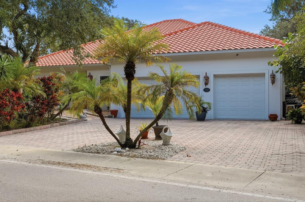 105 Beach Street Ponce Inlet, FL 32127 - Photo 64 of 67 a view of a house with a yard and garage