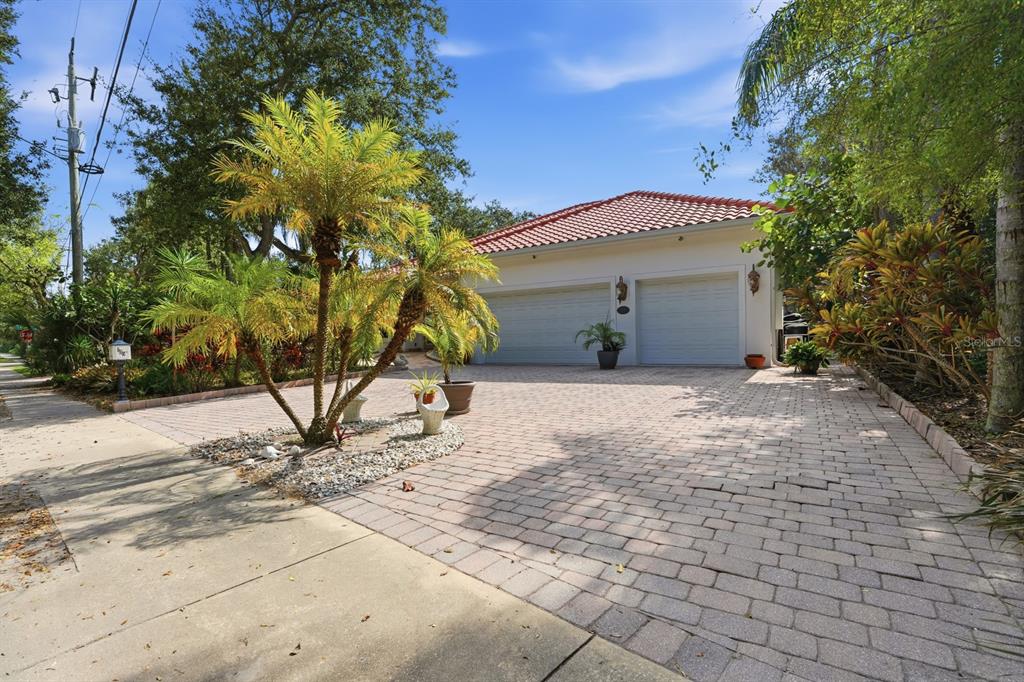 105 Beach Street Ponce Inlet, FL 32127 - Photo 67 of 67 a front view of a house with a yard and garage