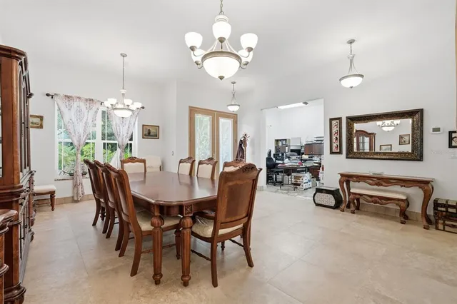 a living room with furniture a flat screen tv and a large window