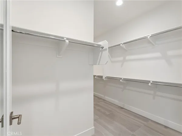 a bedroom with a bed and a cabinet