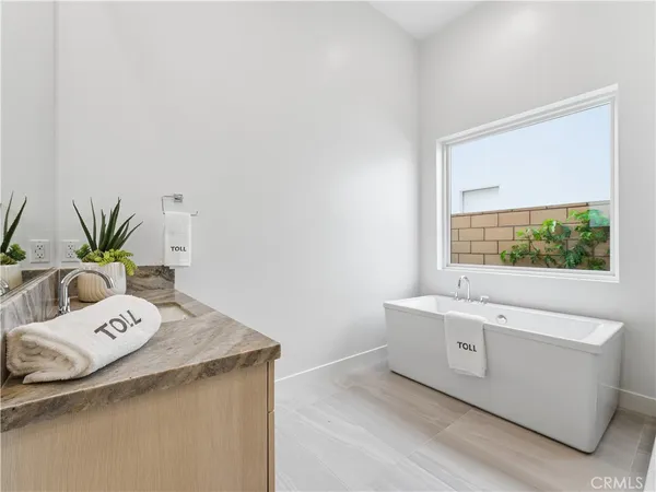 a bathroom with a double vanity sink and mirror