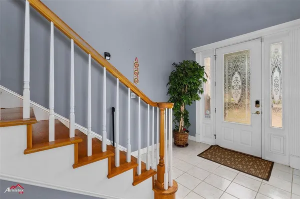 a view of entryway and hall with a window