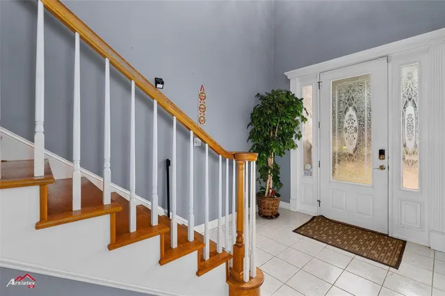 a view of entryway and hall with a window